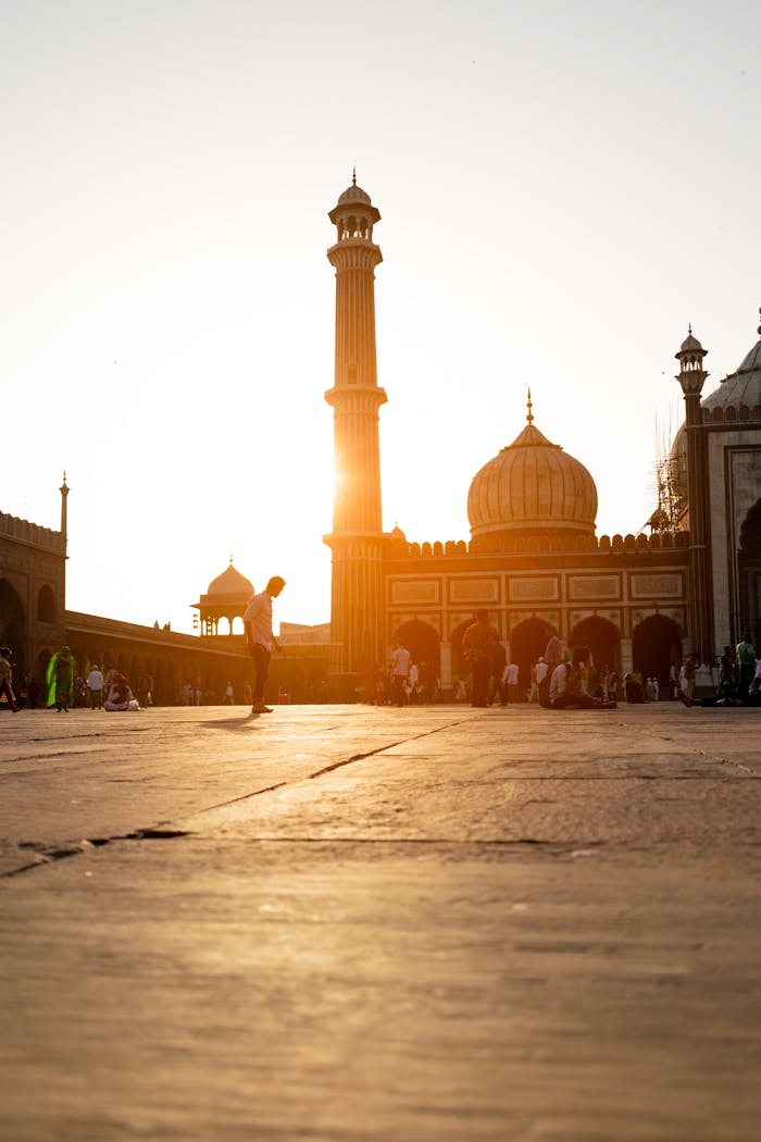 services-02 Beautiful evening view of Jama Masjid in New Delhi with people gathering at sunset.